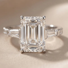 6.44 CT Emerald & Taper Three Stone Ring