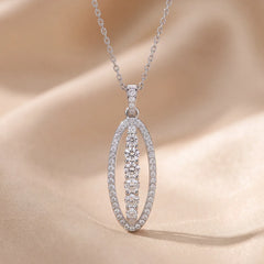 0.63 CT Round Diamond Elongated Oval Halo Pendant