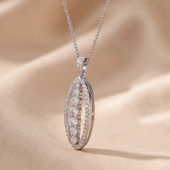 0.63 CT Round Diamond Elongated Oval Halo Pendant