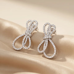 0.59 CT Diamond Bow Stud Earrings