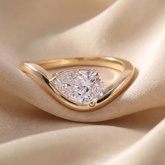 1.08 CT Pear Cut Solitaire Wave Ring