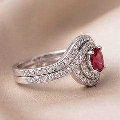 1.11 CT Oval Ruby Halo Crossover Ring