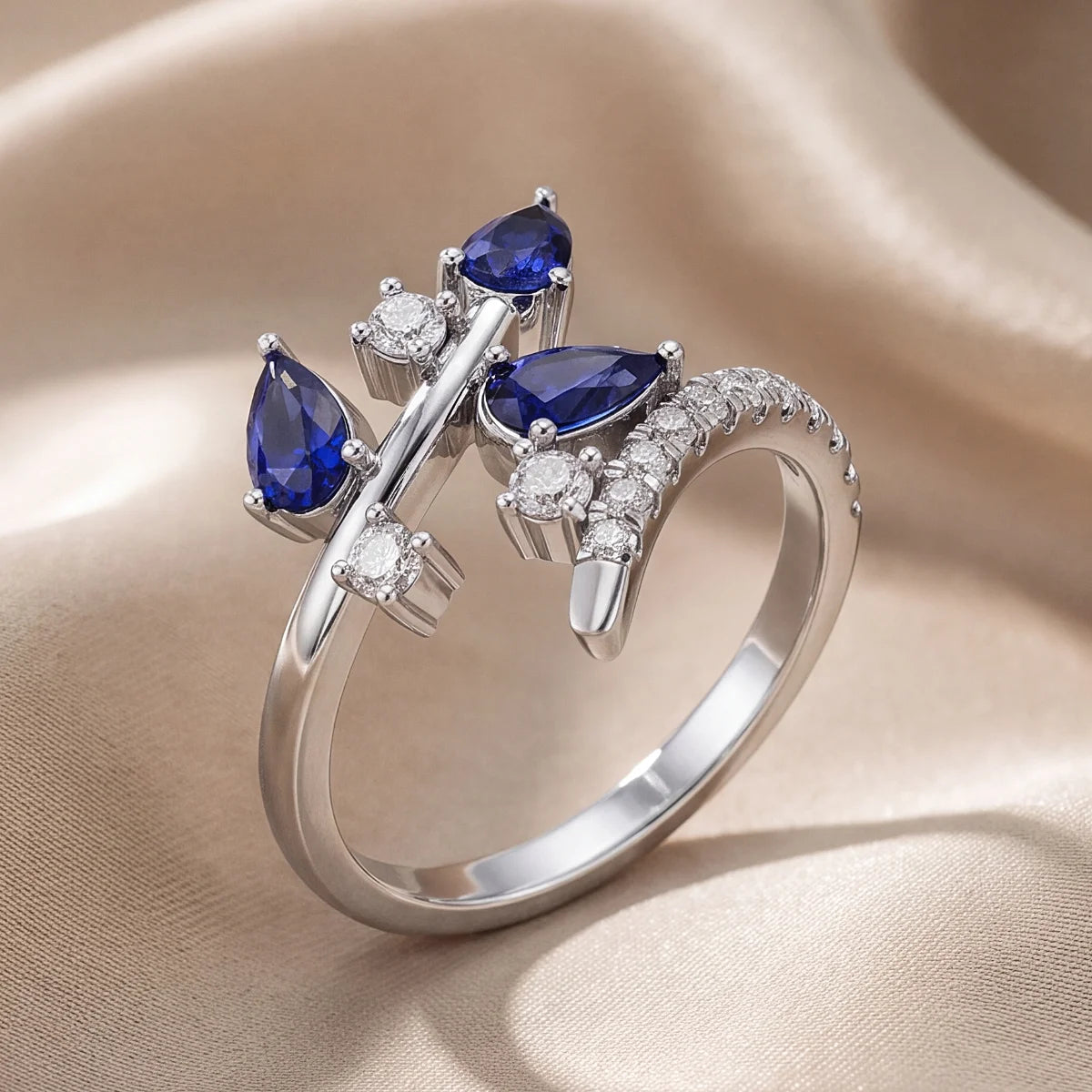 0.73 CT Pear Blue Sapphire Bypass Ring
