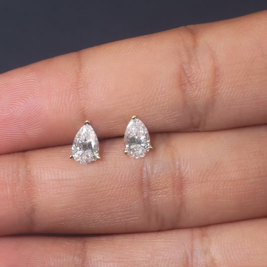 0.54 CT Pear Three-Prong Stud Earrings