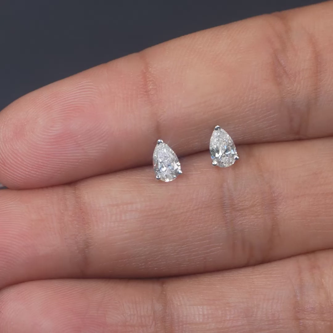 0.54 CT Pear Three-Prong Stud Earrings