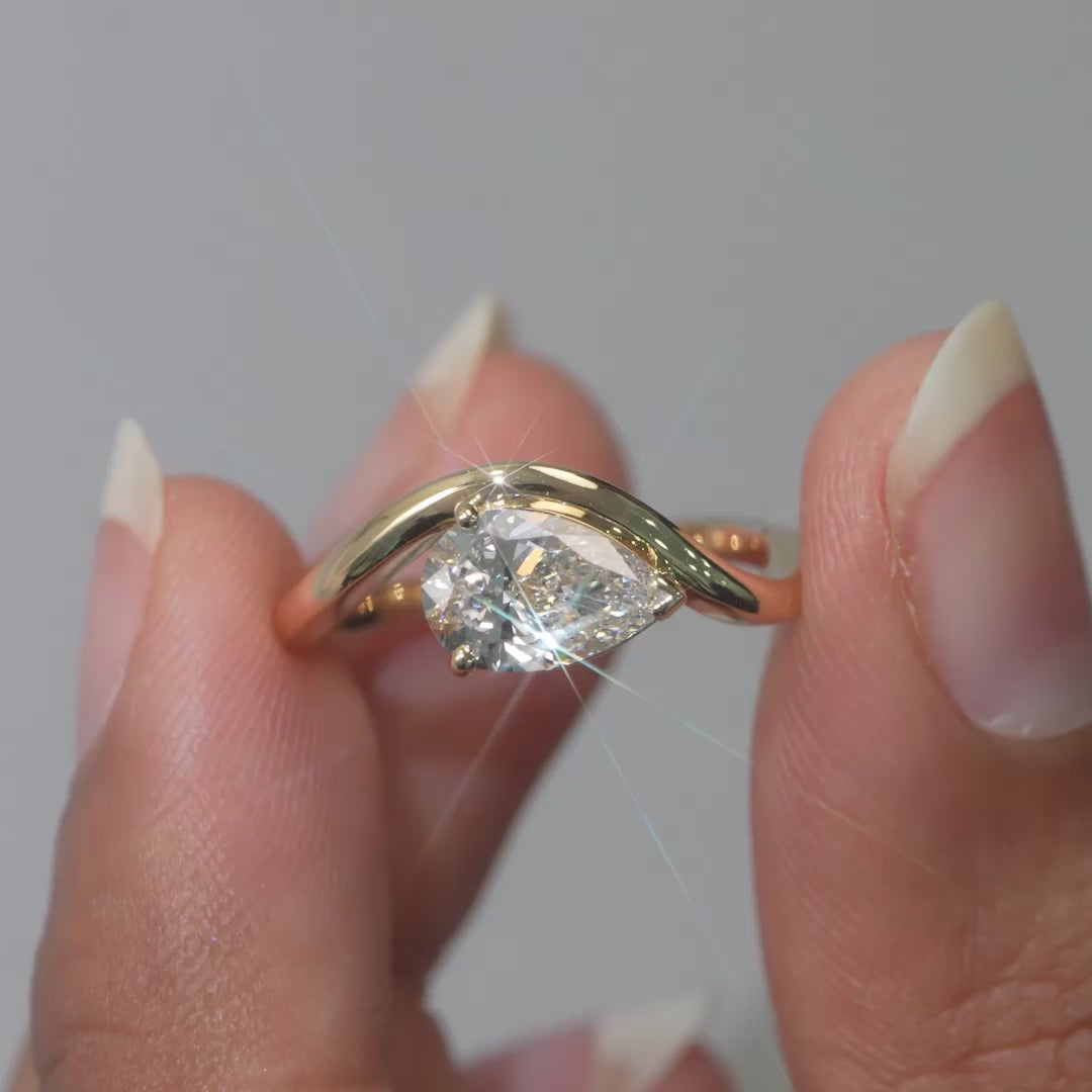 1.08 CT Pear Cut Solitaire Wave Ring